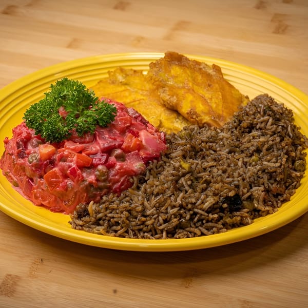 Vegan meal with red salad, fried plantains, and rice on a yellow plate.